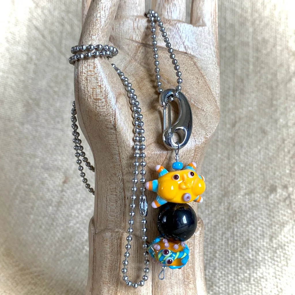 Shungite Clip-on, Necklace, Whimsical Orange Sun Face, Lampwork Glass